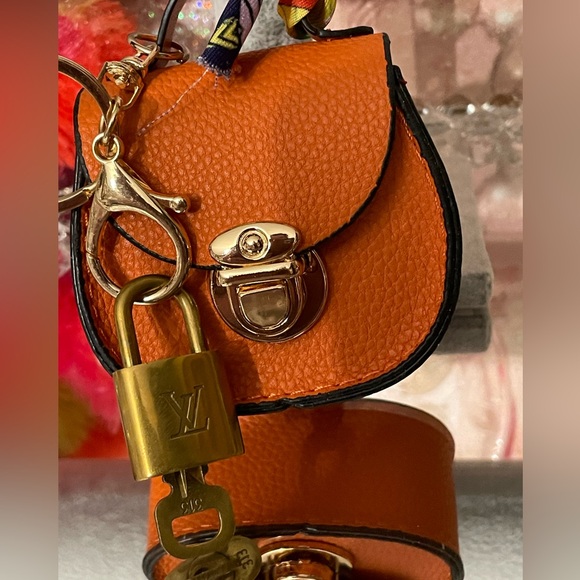 Louis Vuitton Handbags - Louis Vuitton lock and key #313 with Orange Designer Mini Bag Charm